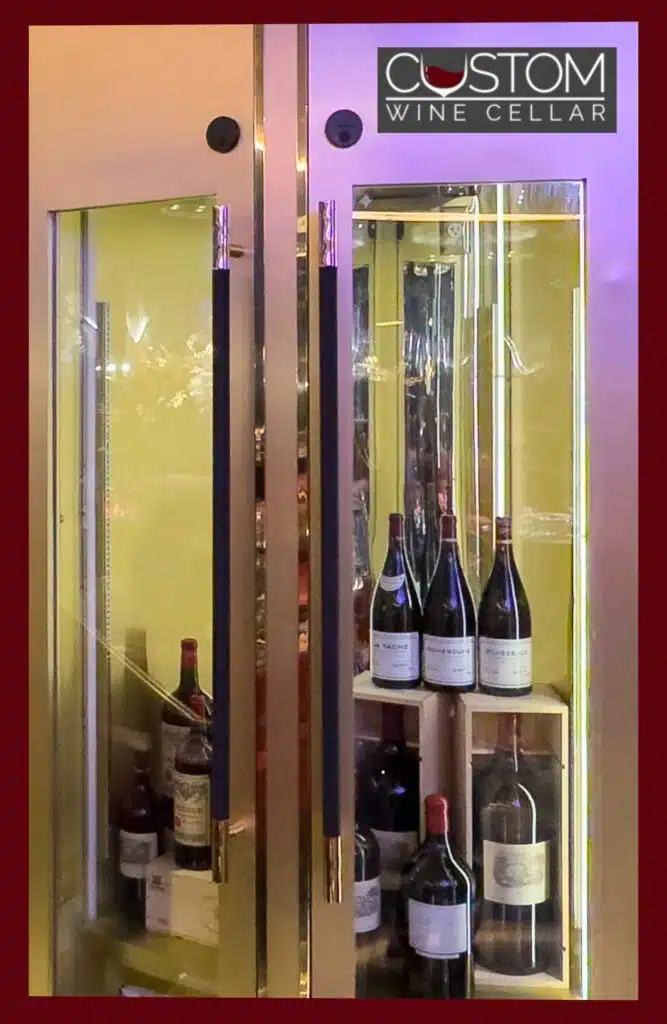 Full length glass wine cellar door with wood frame for a high end restaurant wine cellar design