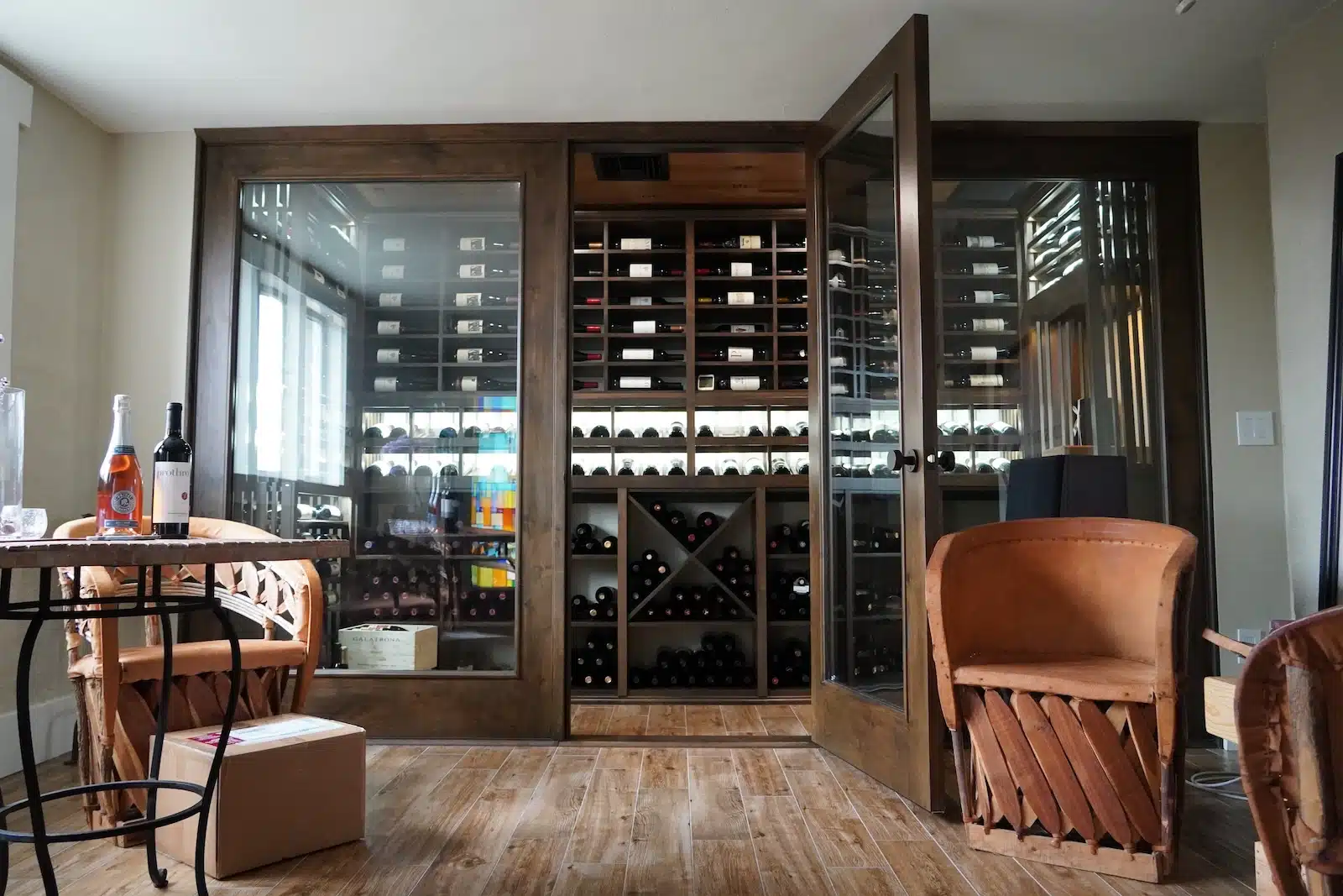 a photo of a wooden wine cellar door with insulated glass panels 