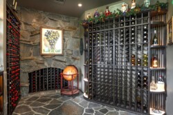 45 - This old-age style wine room is complete with centuries old-inspired trinkets and stonework photo of old-age-style home wine cellar