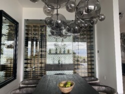 4 - Frameless Glass Custom Wine Cellar Doors Designed in a Dining Area in Dana Point Stylish Modern Wine Cellars in a Dining Room in California