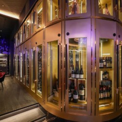 Curated display for an Orange County custom restaurant wine cellar design.