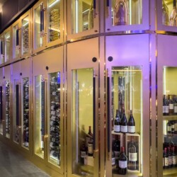 In this restaurant wine cellar design, champagnes are stored on the upper sections.