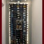 Frameless glass doors are perfect for small wine closets like this wine cellar built in a hallway. Small wine closet with frameless glass door