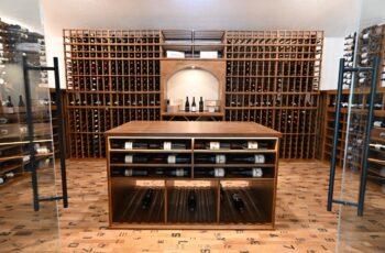 10 - The center island elevates this wine room experience.