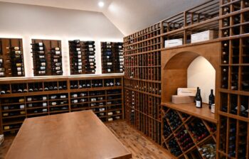 8 - center island display with custom wine racks in luxury wine cellar