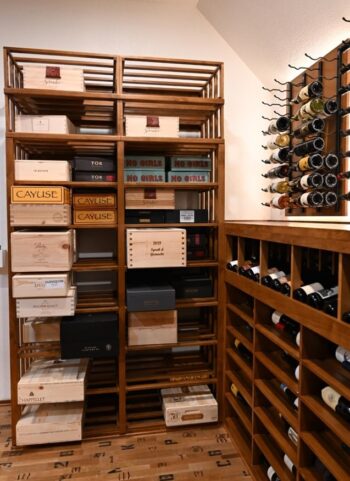 6 - custom wine case shelving with open lattice design in wine cellar