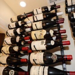 (11) Simple recessed lights are enough to complete the mood in small wine closet designs.