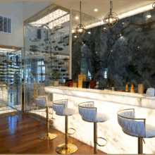 (1) An alabaster countertop was the perfect glass wine cellar idea that instantly catapulted the elegance of this space.